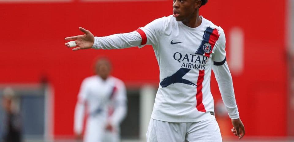 Player gesturing during match in PSG uniform