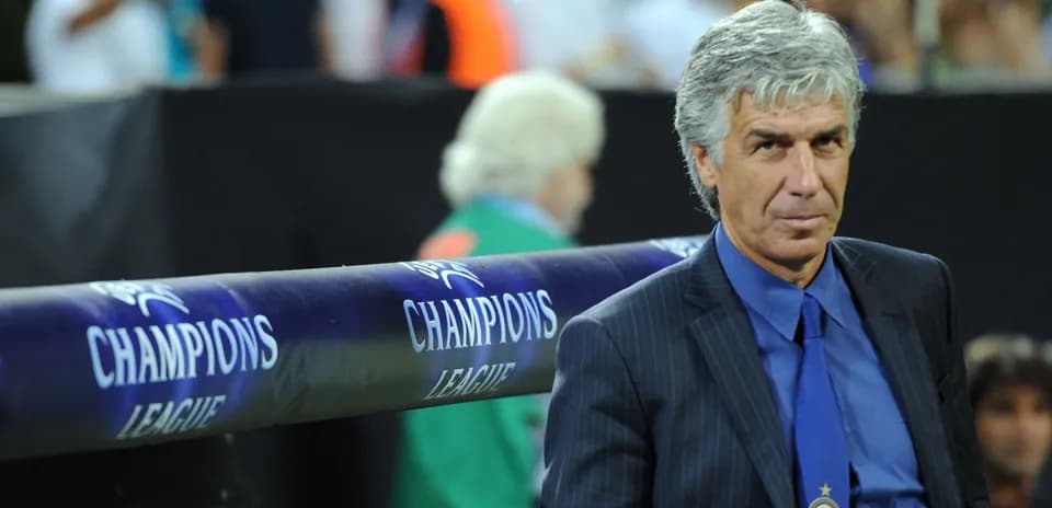 Coach sitting on bench during Champions League match