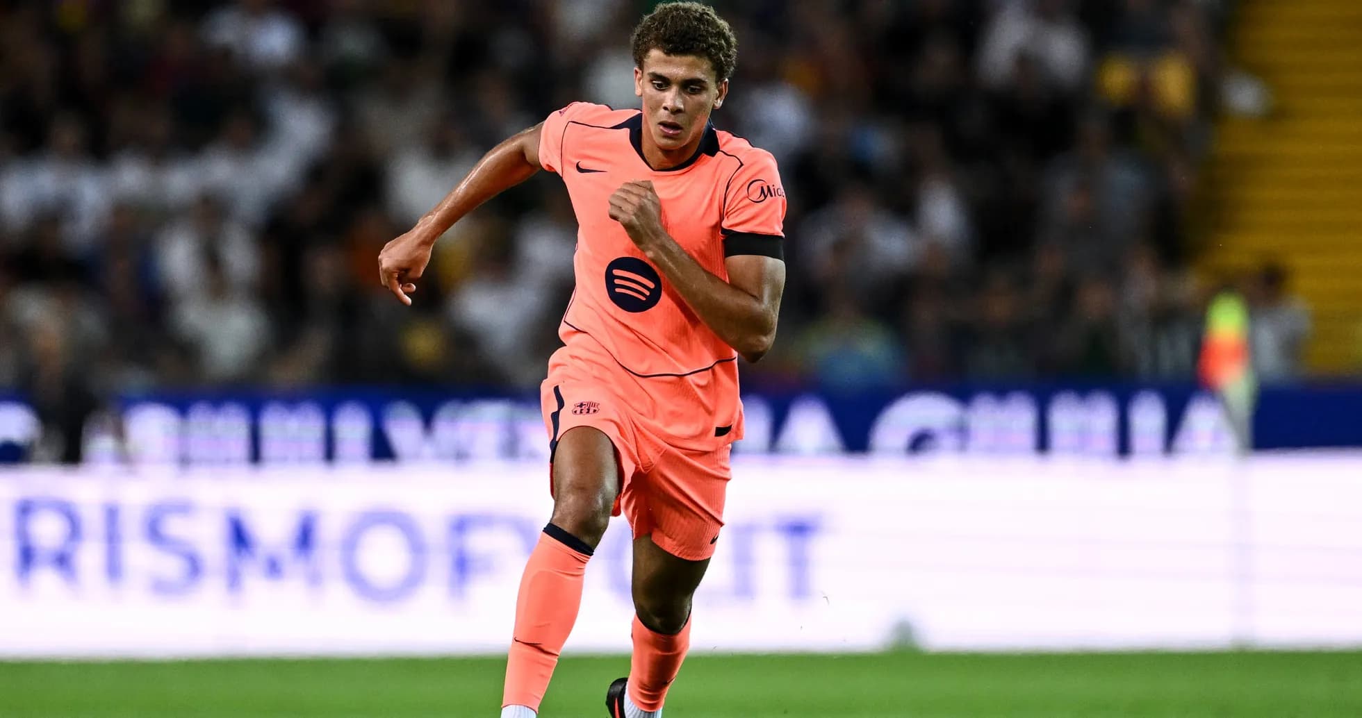 Player running with ball during a match