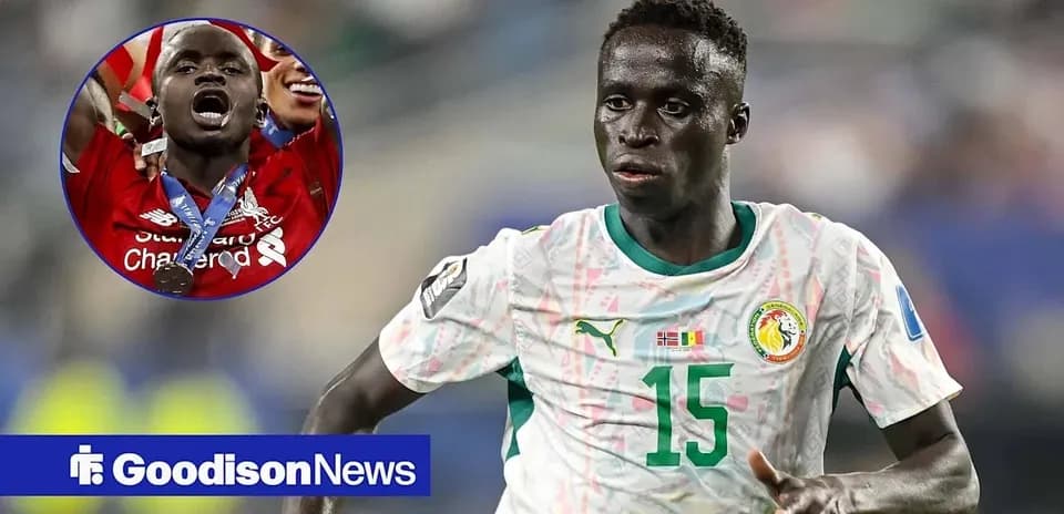 Player running in Senegal national team jersey during match