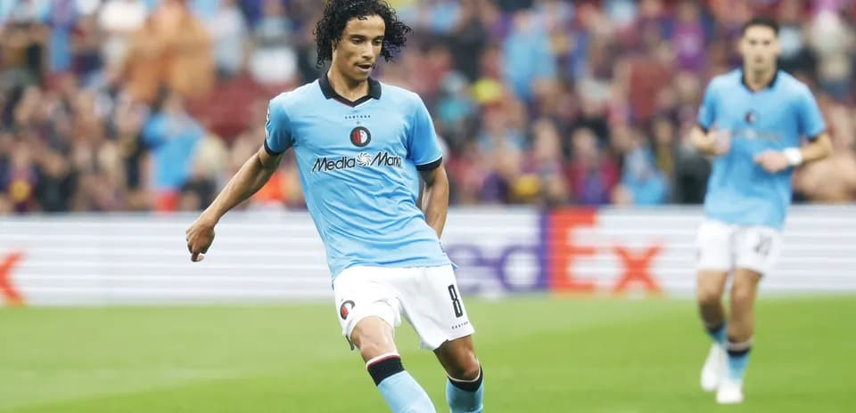 Player in blue kit preparing to kick ball