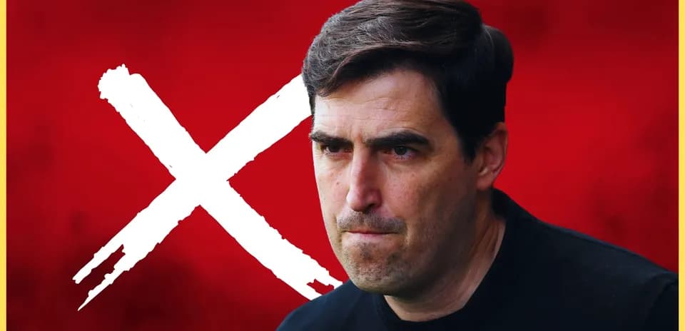 Coach looking serious against a red background