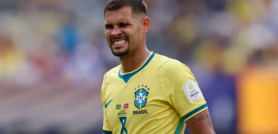 Brazilian player grimacing on the field during match