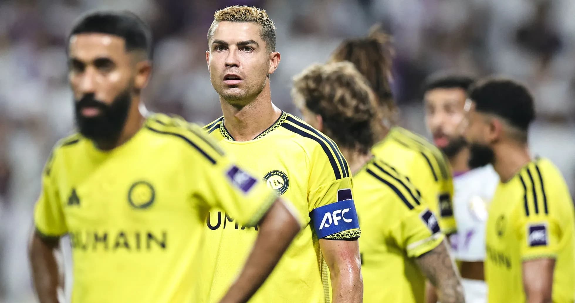 Cristiano Ronaldo and teammates in yellow jerseys during match