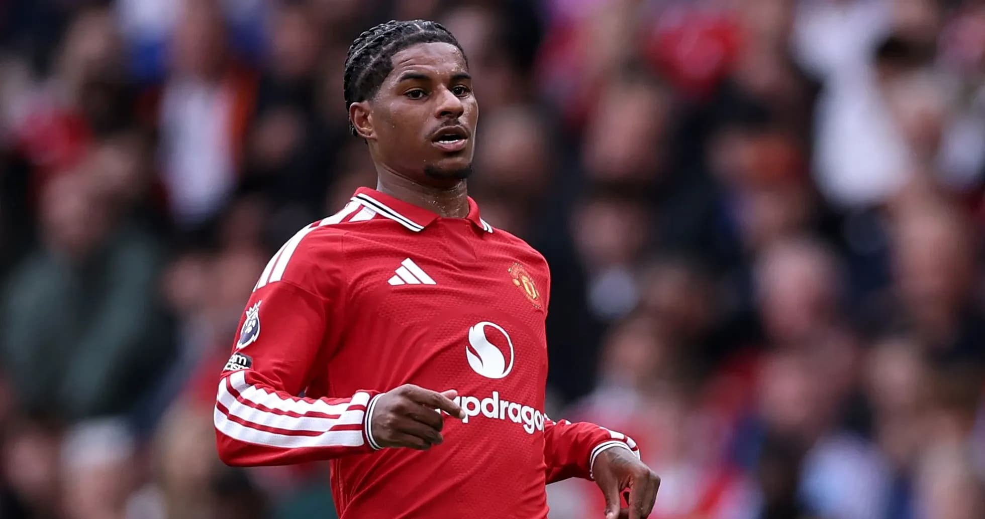 Player running on the field in Manchester United kit