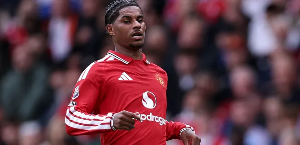 Player running on the field in Manchester United kit