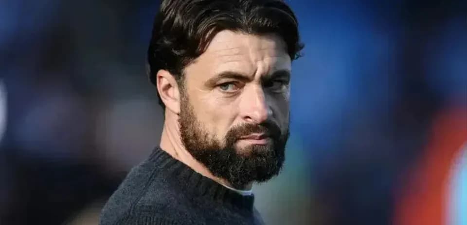 Coach looking thoughtfully during a match