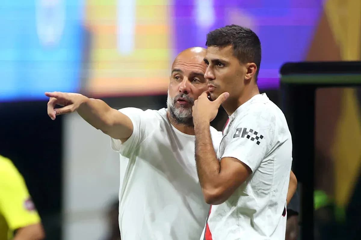 Coach giving instructions to player on sidelines