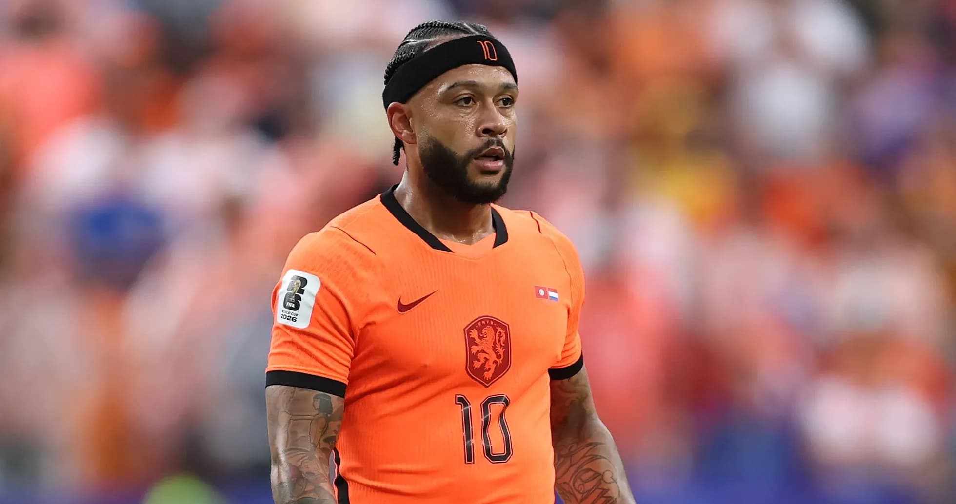 Player in orange jersey during match action