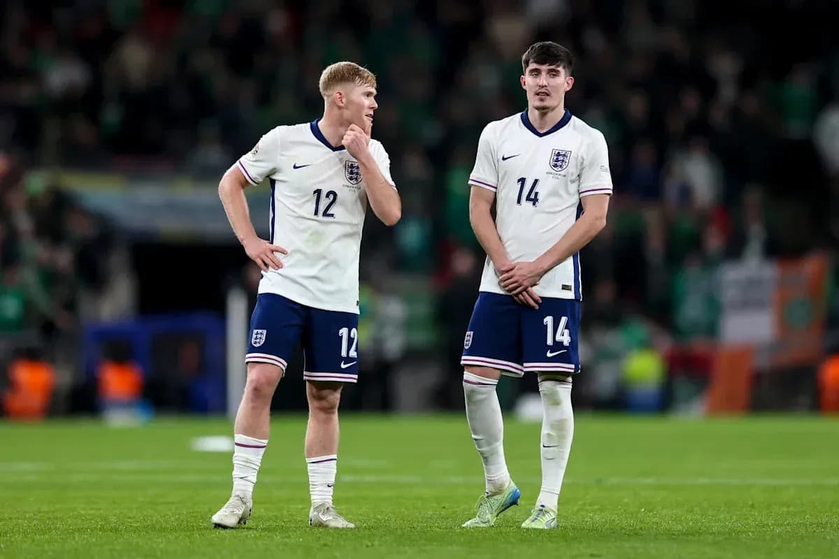 Two England players on the field after match