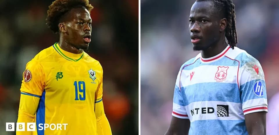 Two soccer players wearing national and club jerseys