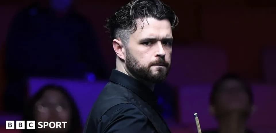 Snooker player preparing for a shot at the table