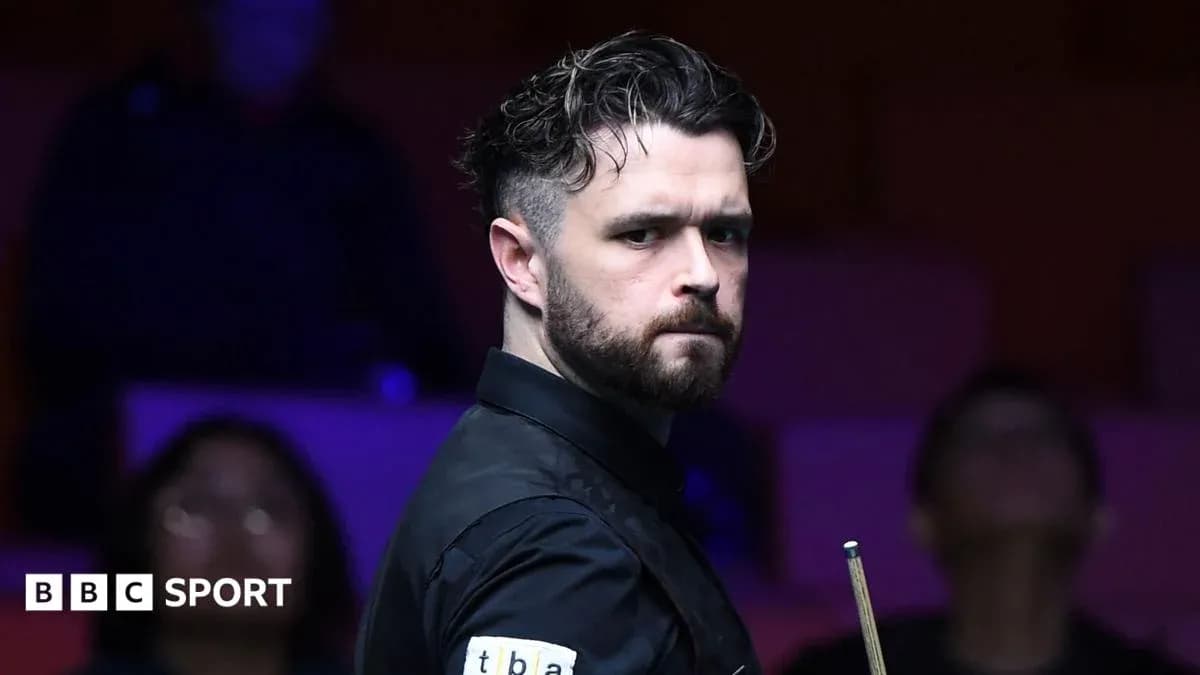 Snooker player preparing for a shot at the table