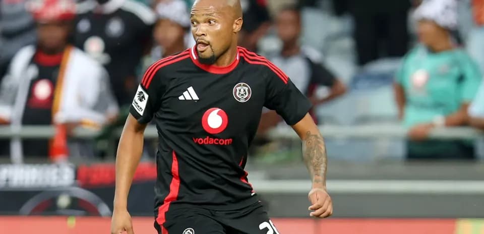 Player wearing black jersey running on the field