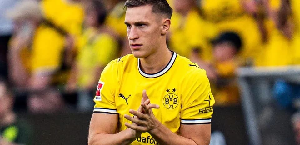 Player in yellow jersey during match warm-up