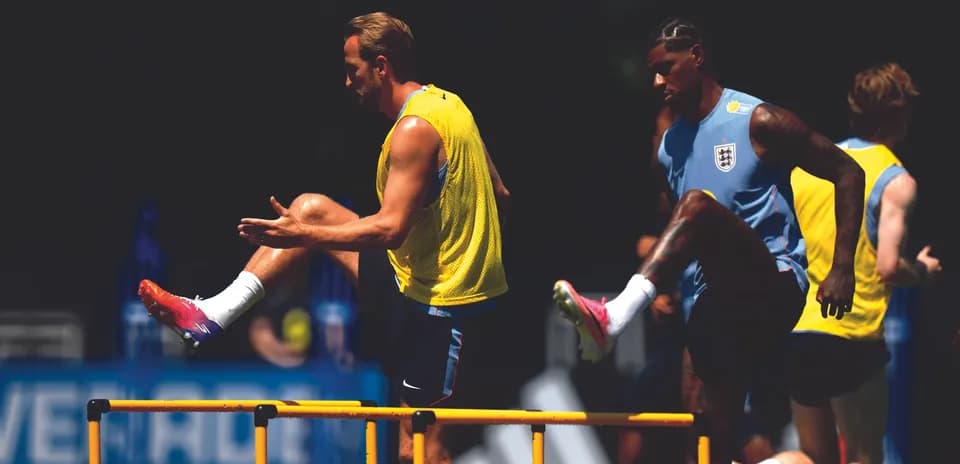 Players practicing hurdle drills during training session