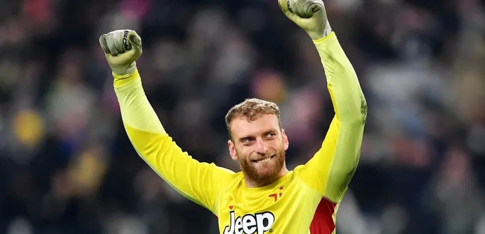 Goalkeeper celebrating victory with raised fists