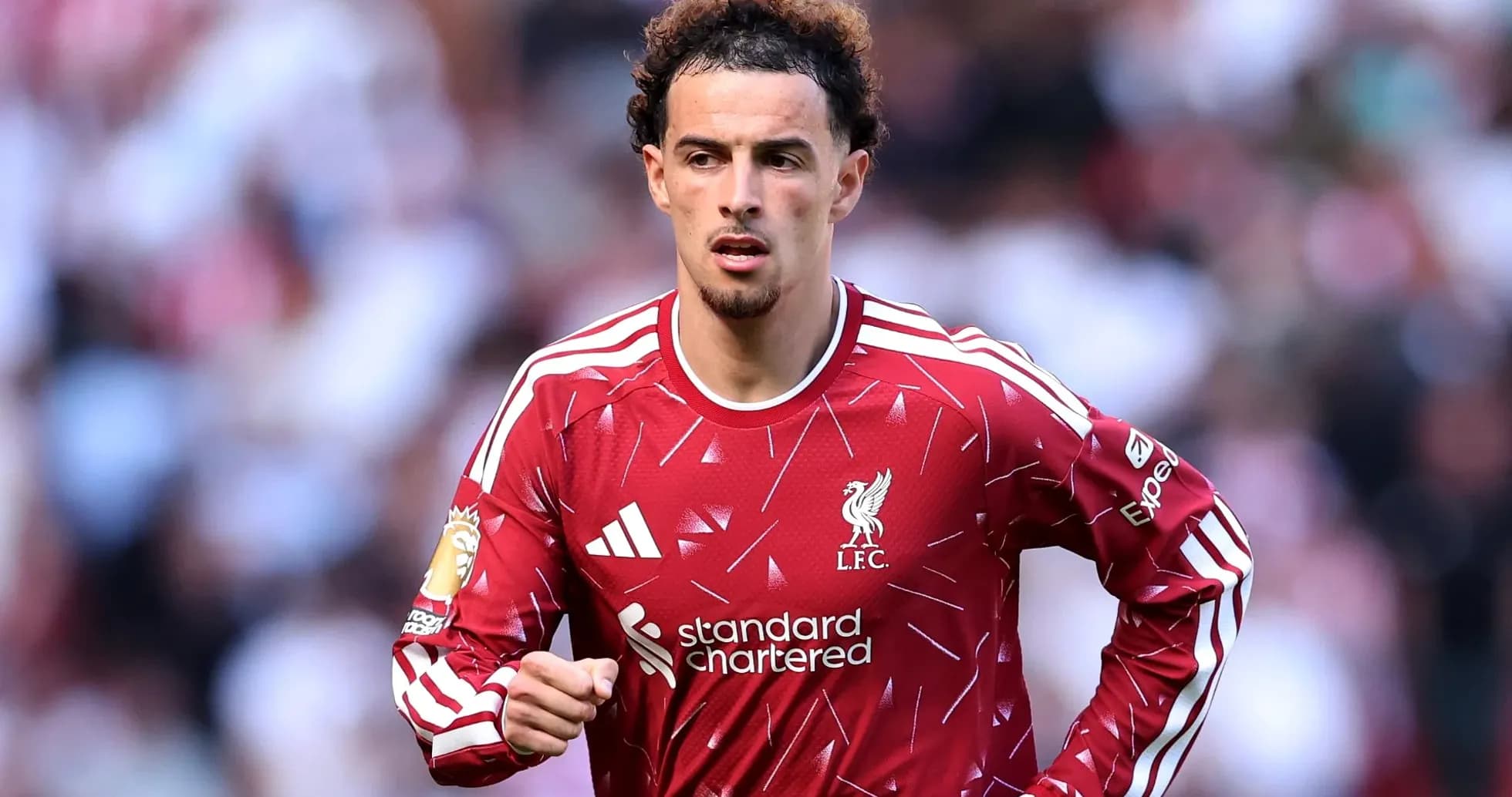 Player in Liverpool jersey during match action