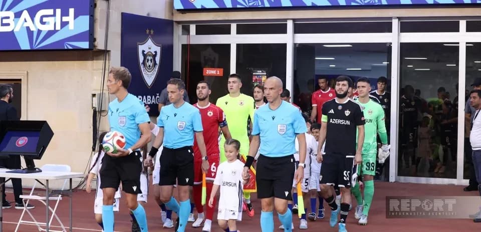 Teams entering the pitch for Qarabag match