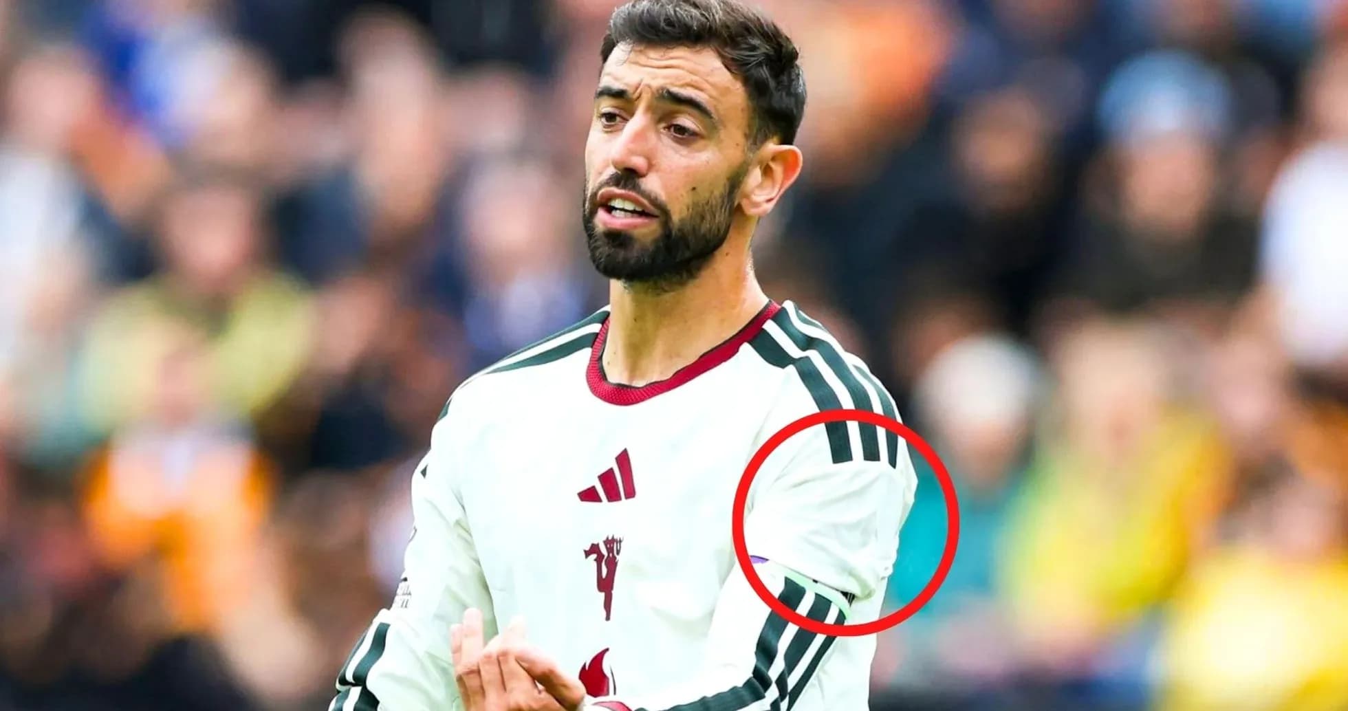 Player gesturing during match in white jersey