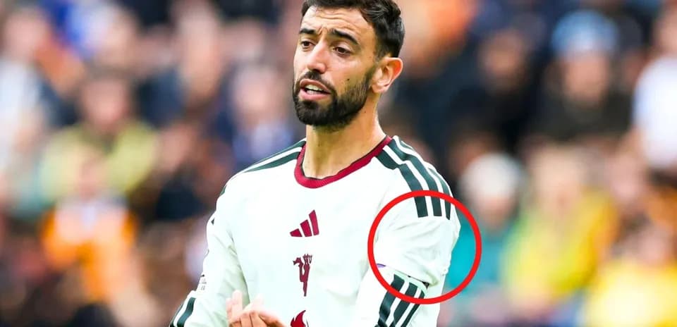 Player gesturing during match in white jersey