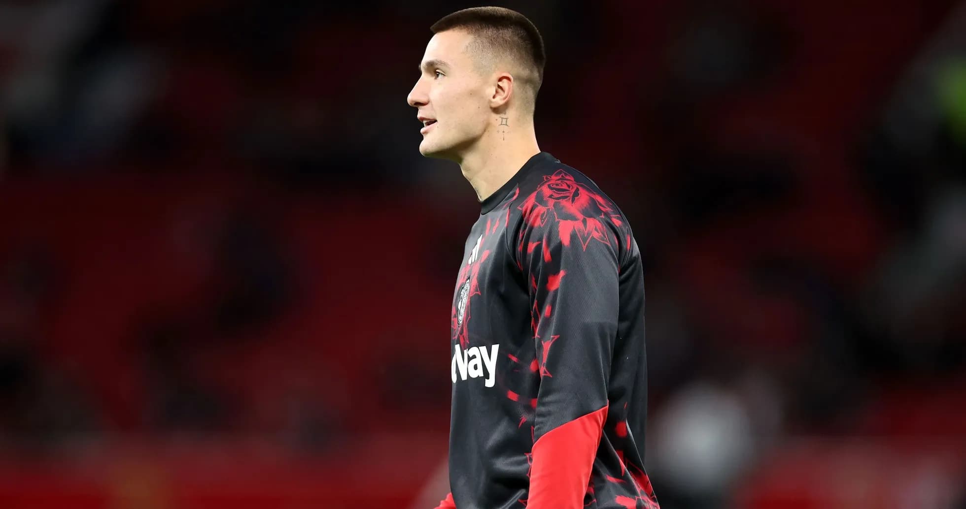 Goalkeeper warming up on the pitch before match