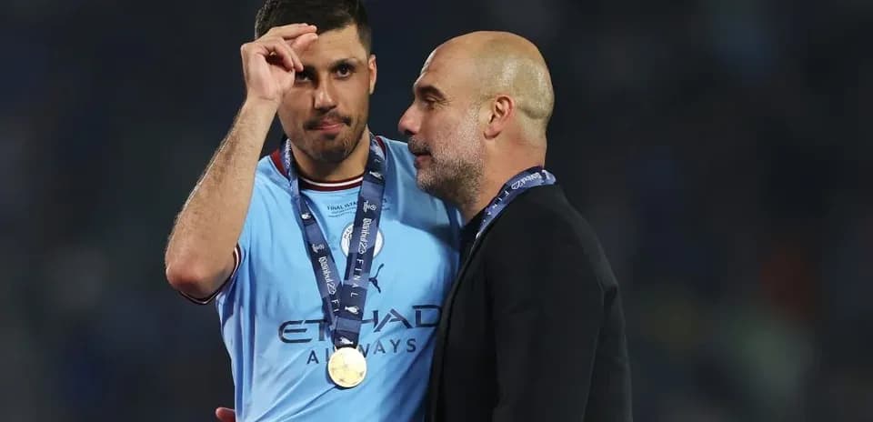 Player and manager celebrating post-match victory