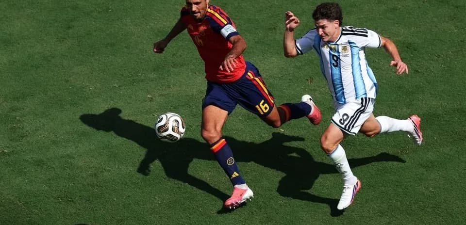 Two players competing for the ball during match