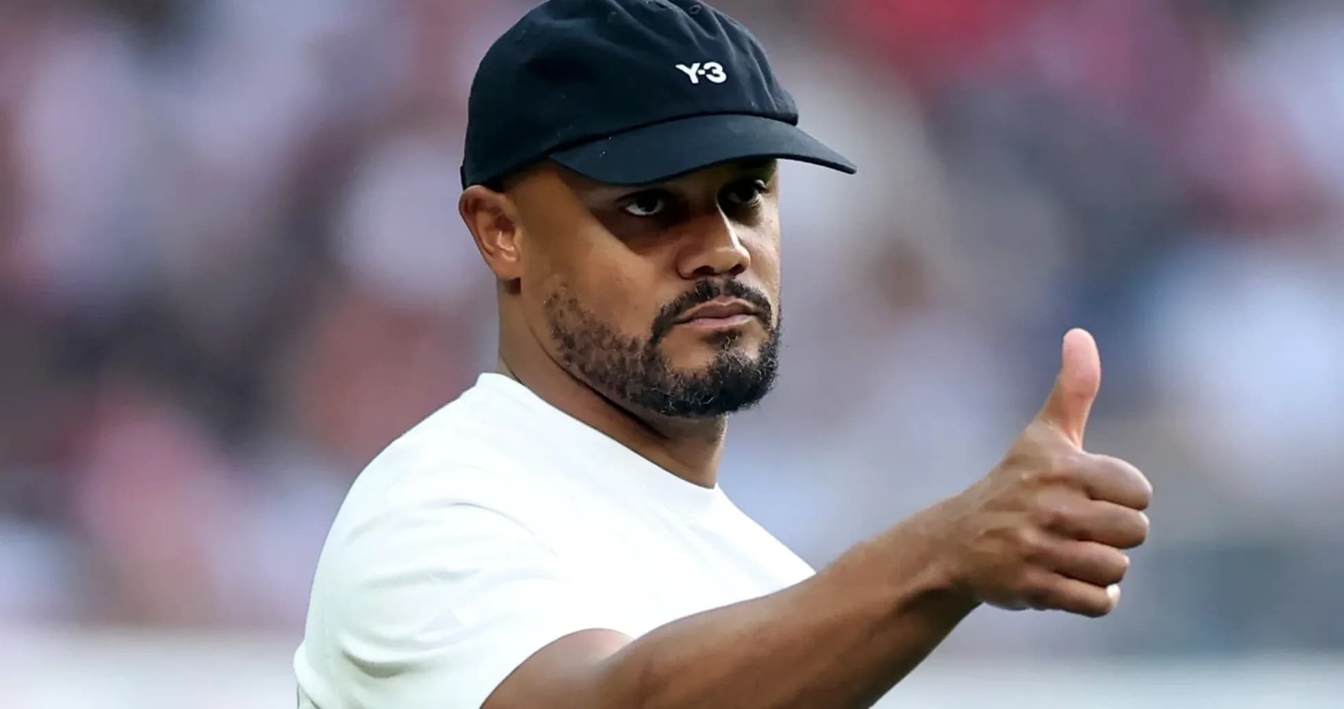 Man in cap giving thumbs up gesture