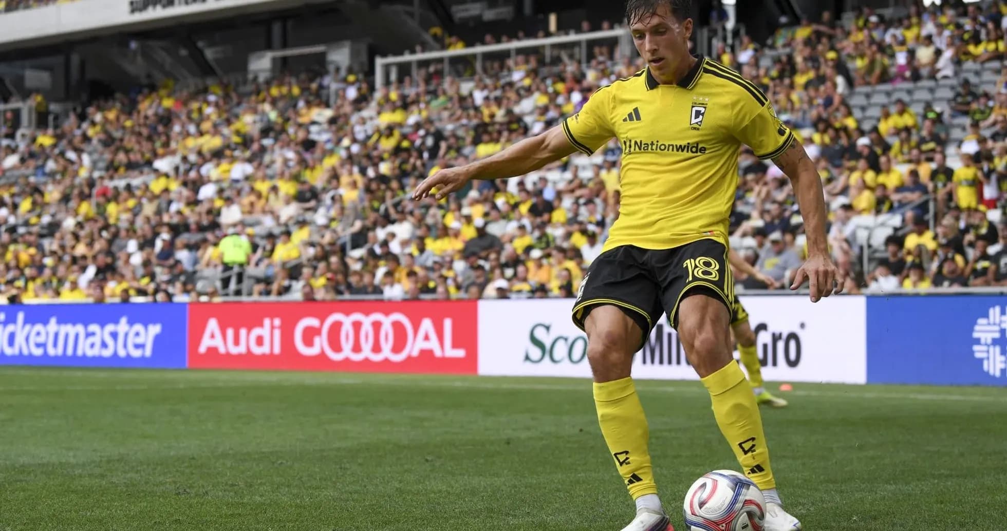 Columbus Crew player taking a corner kick