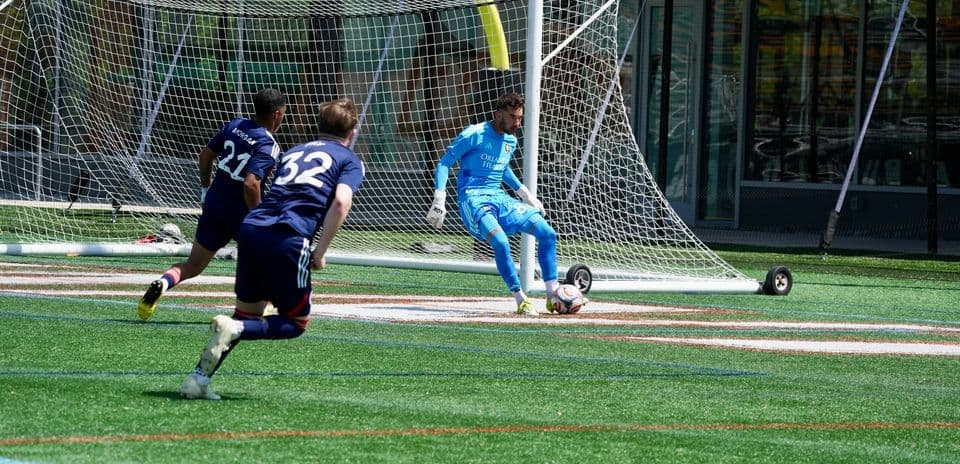 Goalkeeper preparing to make a save during match