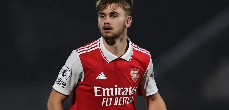 Player wearing Arsenal jersey during match action