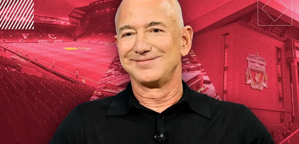 Person smiling with Liverpool FC stadium in background