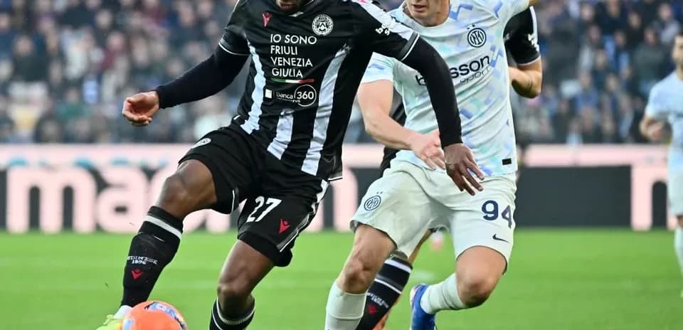 Player tackling during Inter vs Udinese match