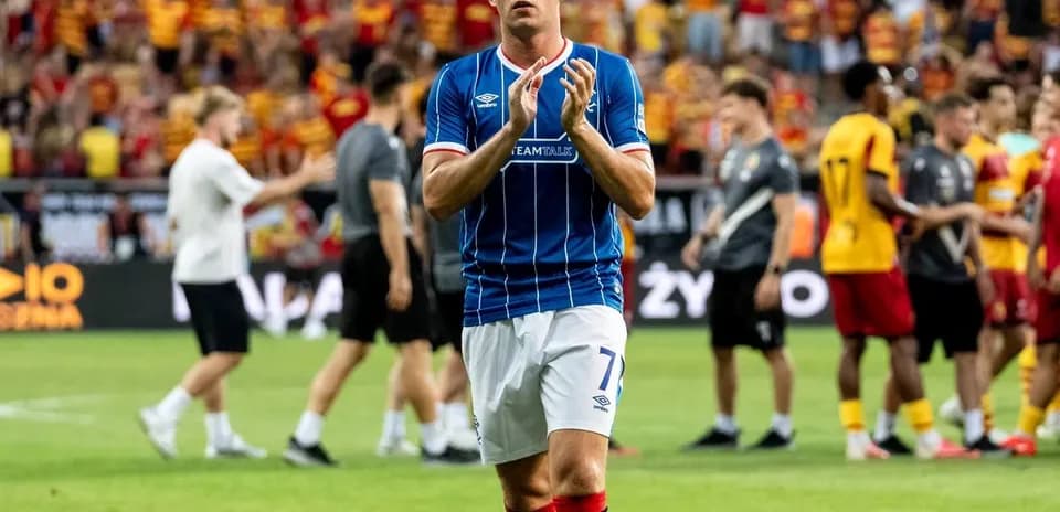 Rangers player applauding fans after match