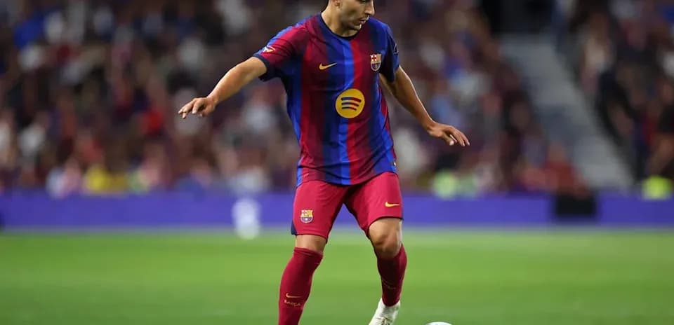 Player dribbling the ball on the pitch