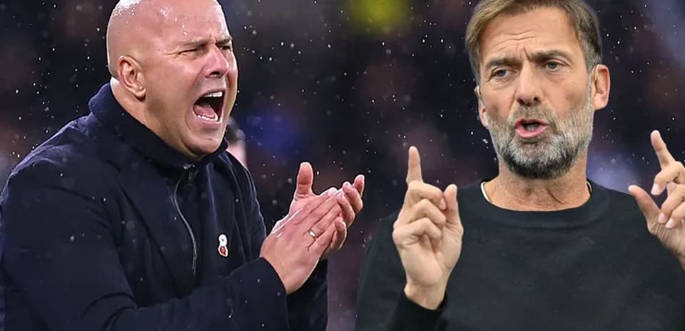 Two football managers reacting during a match