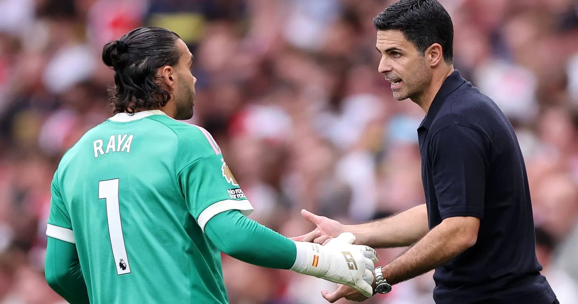 Goalkeeper receiving instructions from the manager