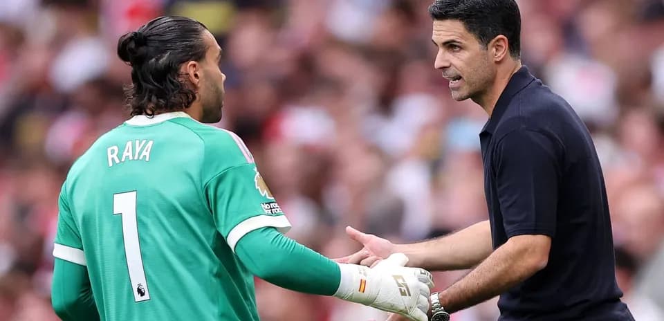 Goalkeeper receiving instructions from the manager