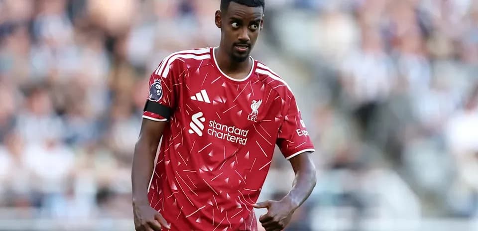 Liverpool player gesturing during match on field