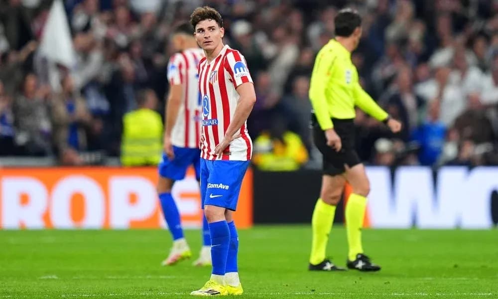 Atletico Madrid player looking dejected on pitch