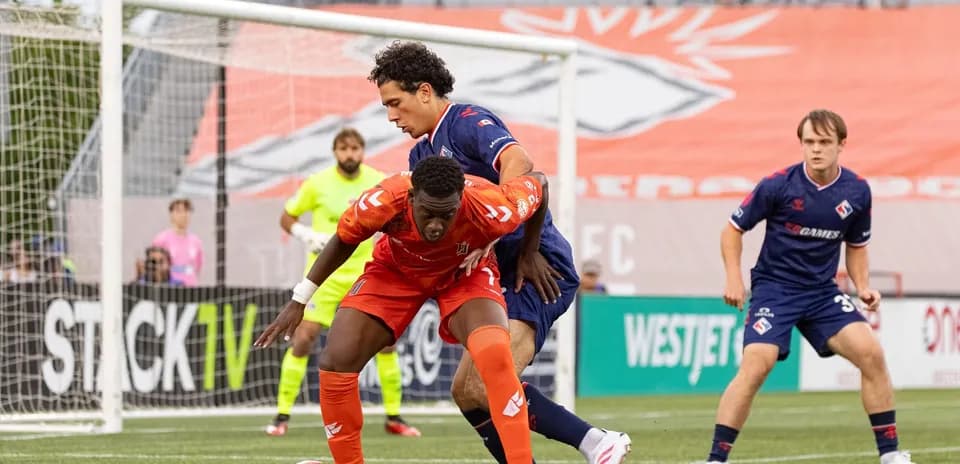 Players battling for the ball during match