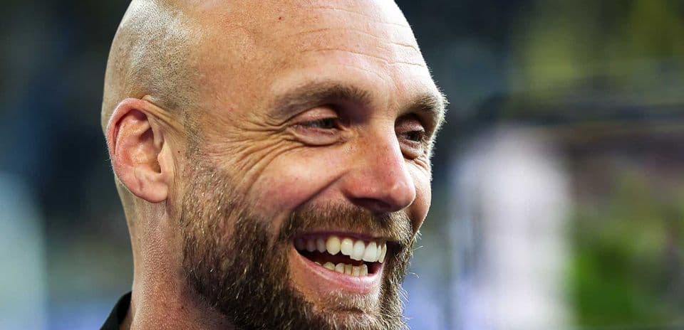 Smiling man with a beard during an event