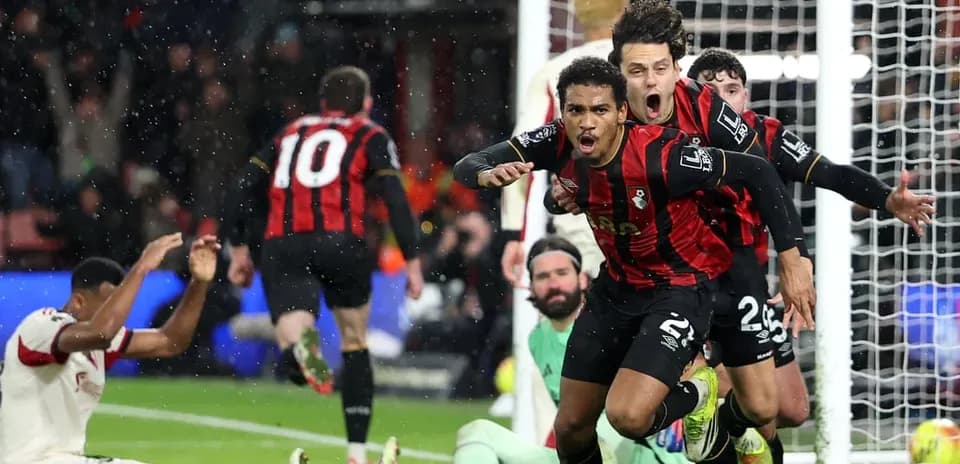 Bournemouth players celebrating a goal against Liverpool