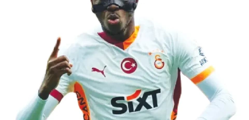 Player celebrating goal wearing mask and jersey