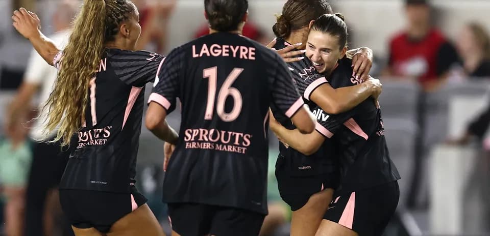 Players celebrating a goal during match