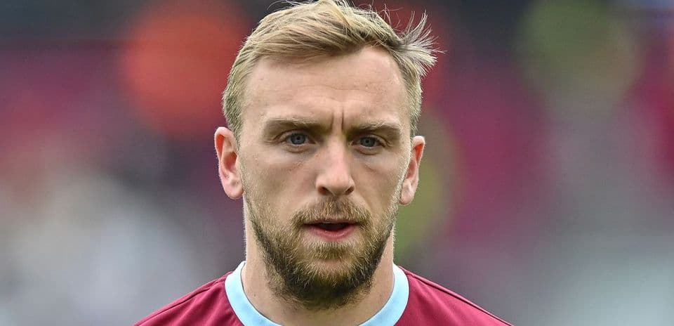 Player in maroon jersey with focused expression