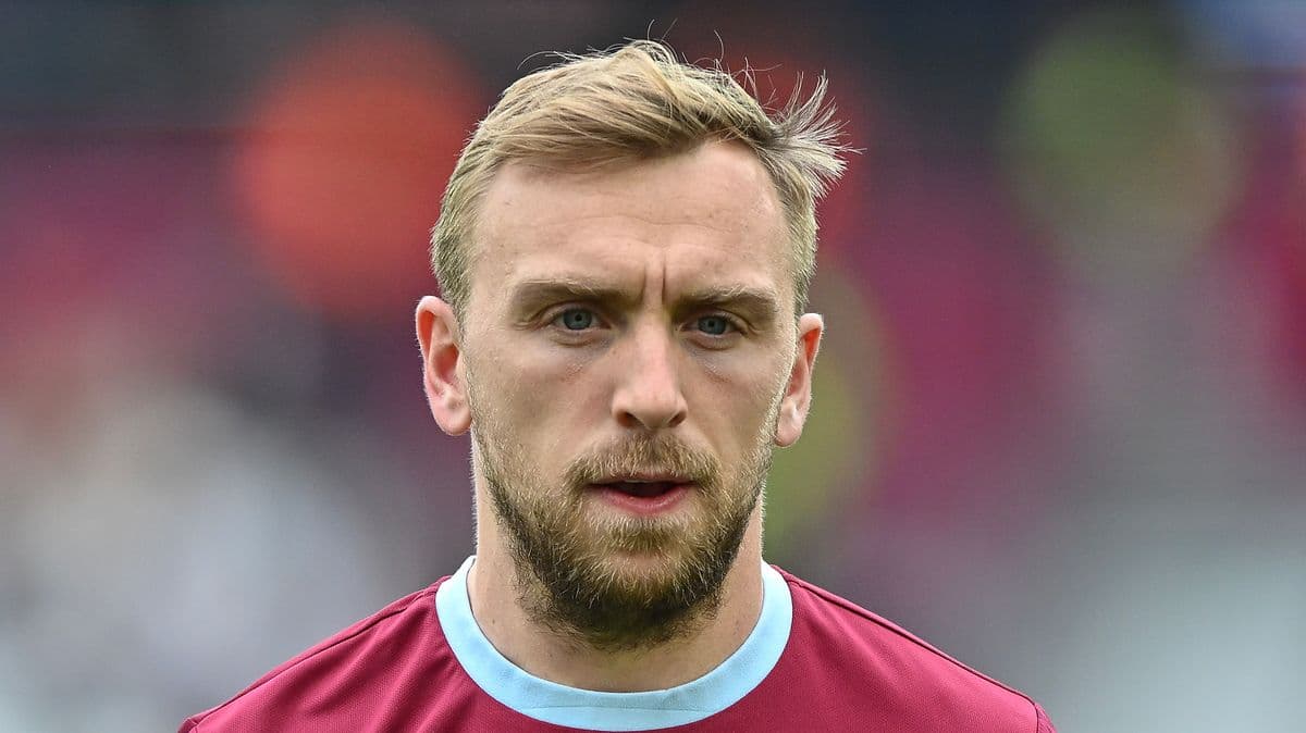 Player in maroon jersey with focused expression