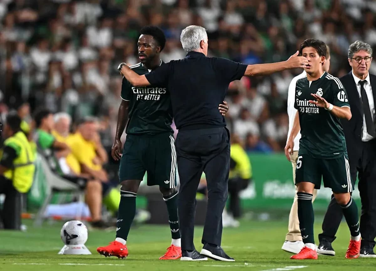 Coach instructing players during a match substitution