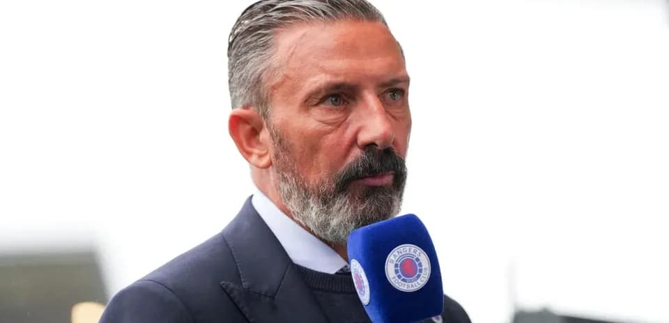 Man speaking into a microphone at an event